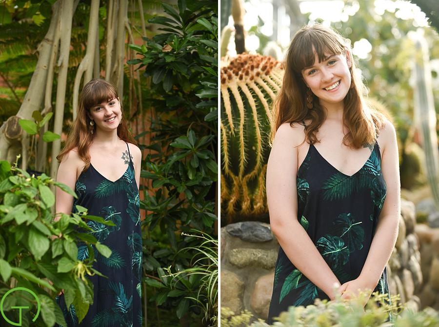 A teenager poses amongst tropical plants at Matthaei Botanical Gardens for her senior session